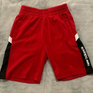 New Balance red and black elastic shorts.